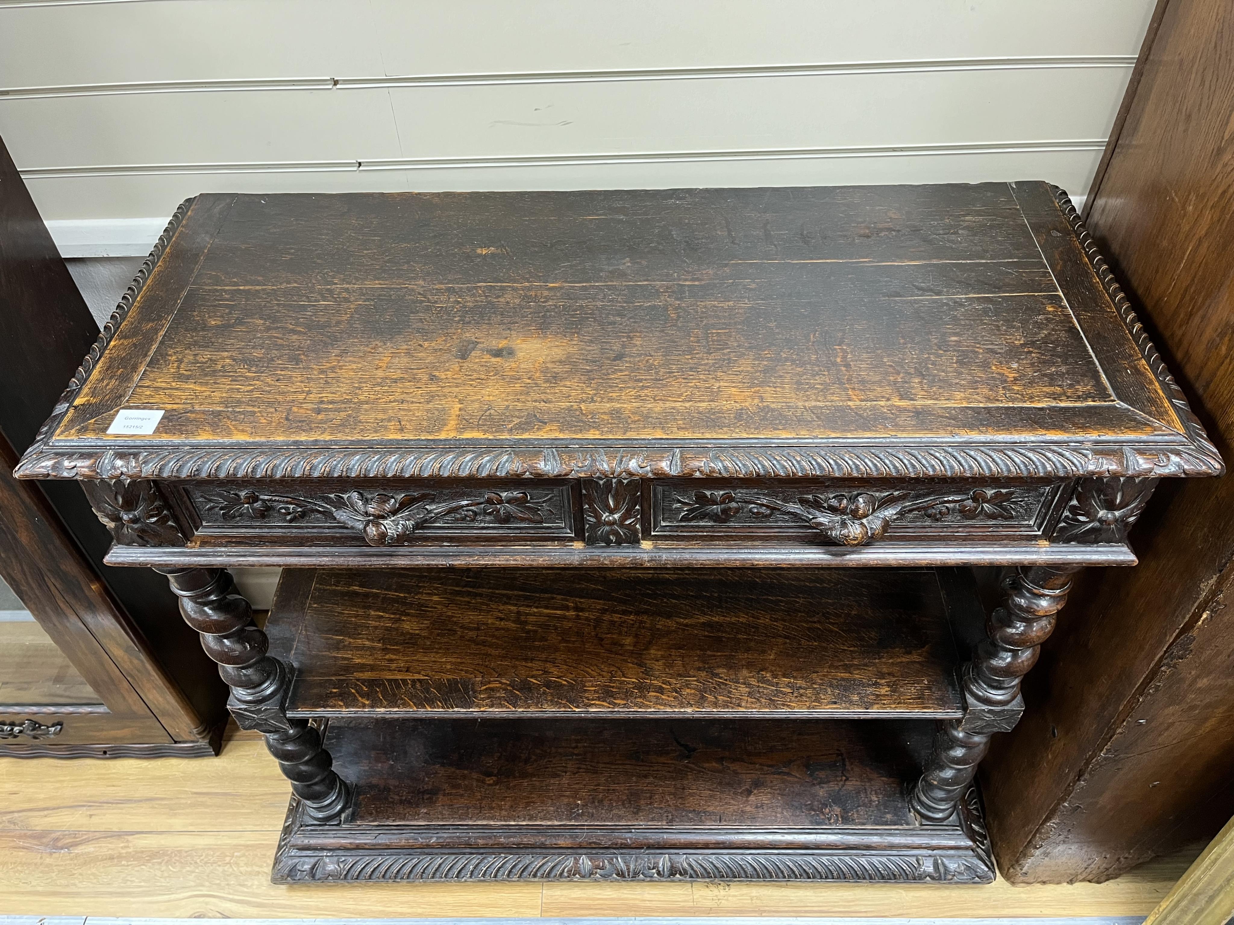 A late 19th century Flemish carved oak buffet, width 105cm, depth 44cm, height 93cm. Condition - fair